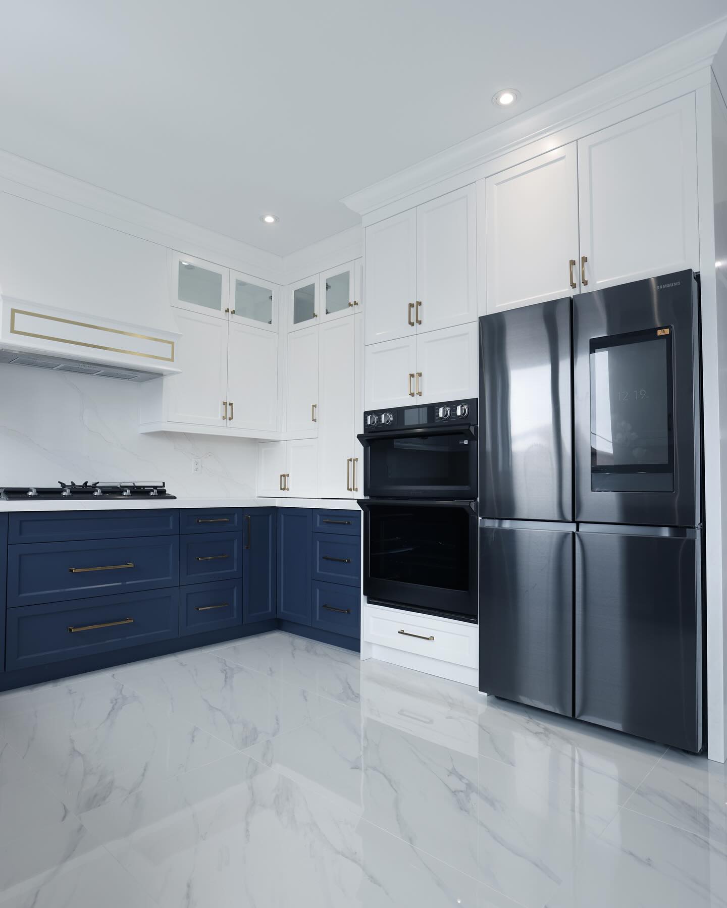 a kitchen with a refrigerator and oven