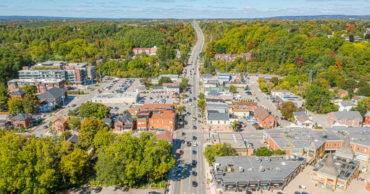 aerial view of a city with many cars and buildings