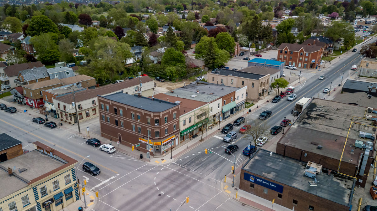 aerial view of a street intersection with cars and buildings