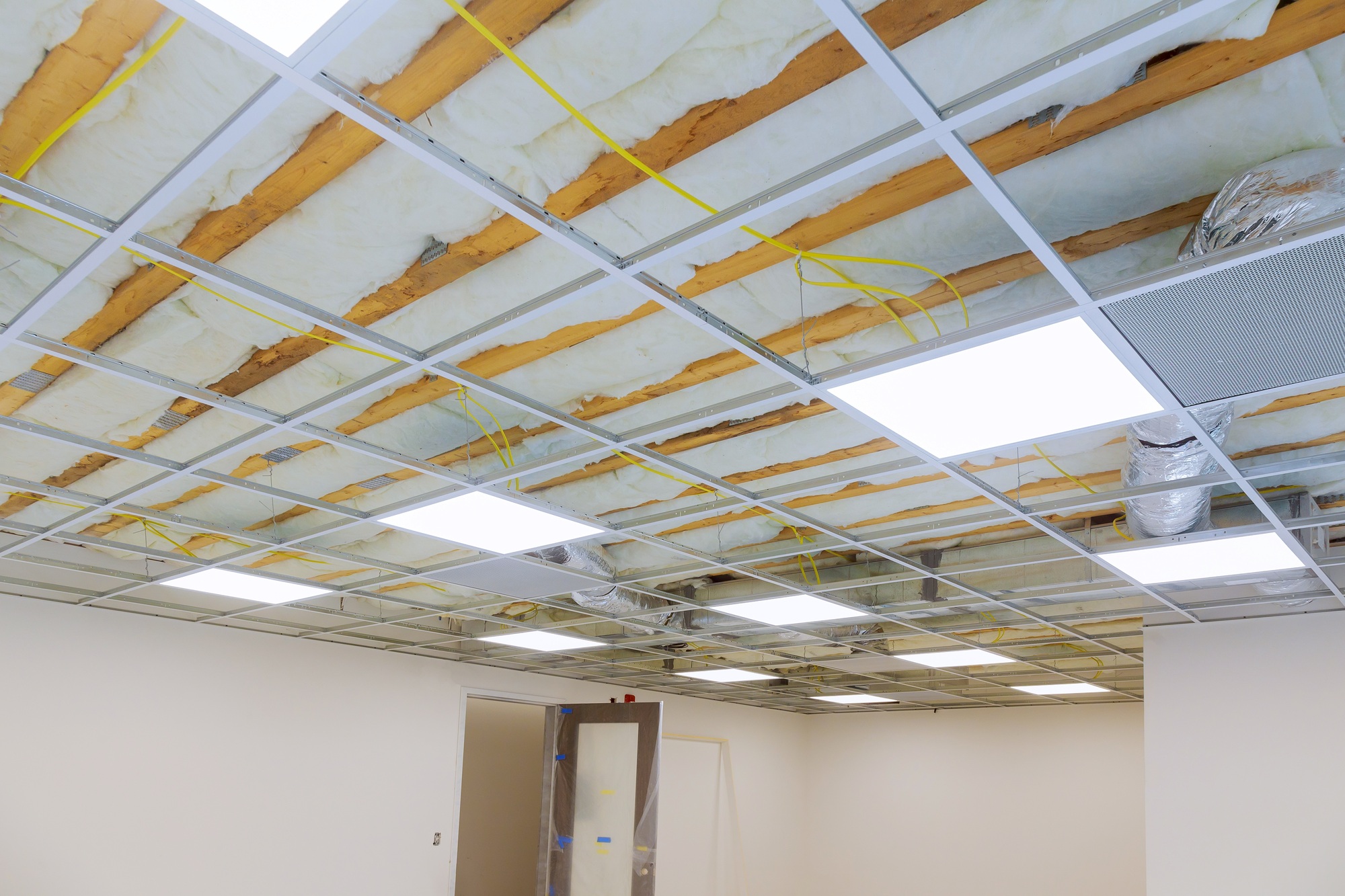 Construction work finishing the ceiling in the great hall