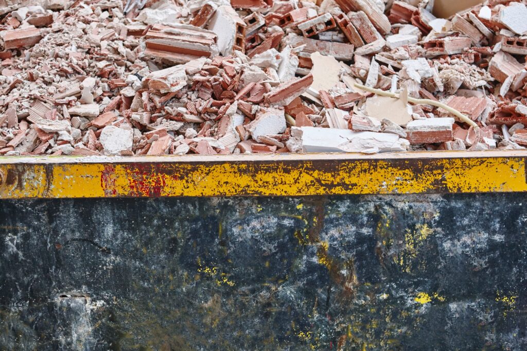 Removal of debris. Construction waste. Building demolition. Devastation background