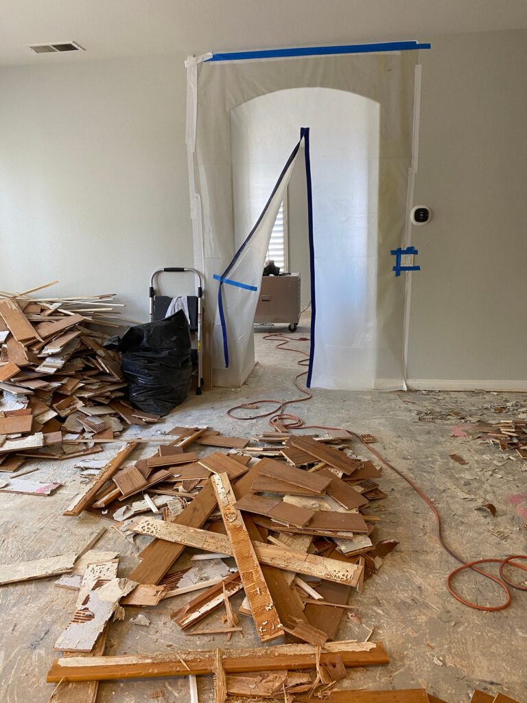 The flooring has been removed and the house is a mess in the middle of a remodel and demolition